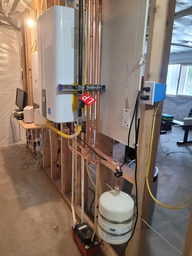 Licensed plumber repairing a kitchen sink in Uxbridge